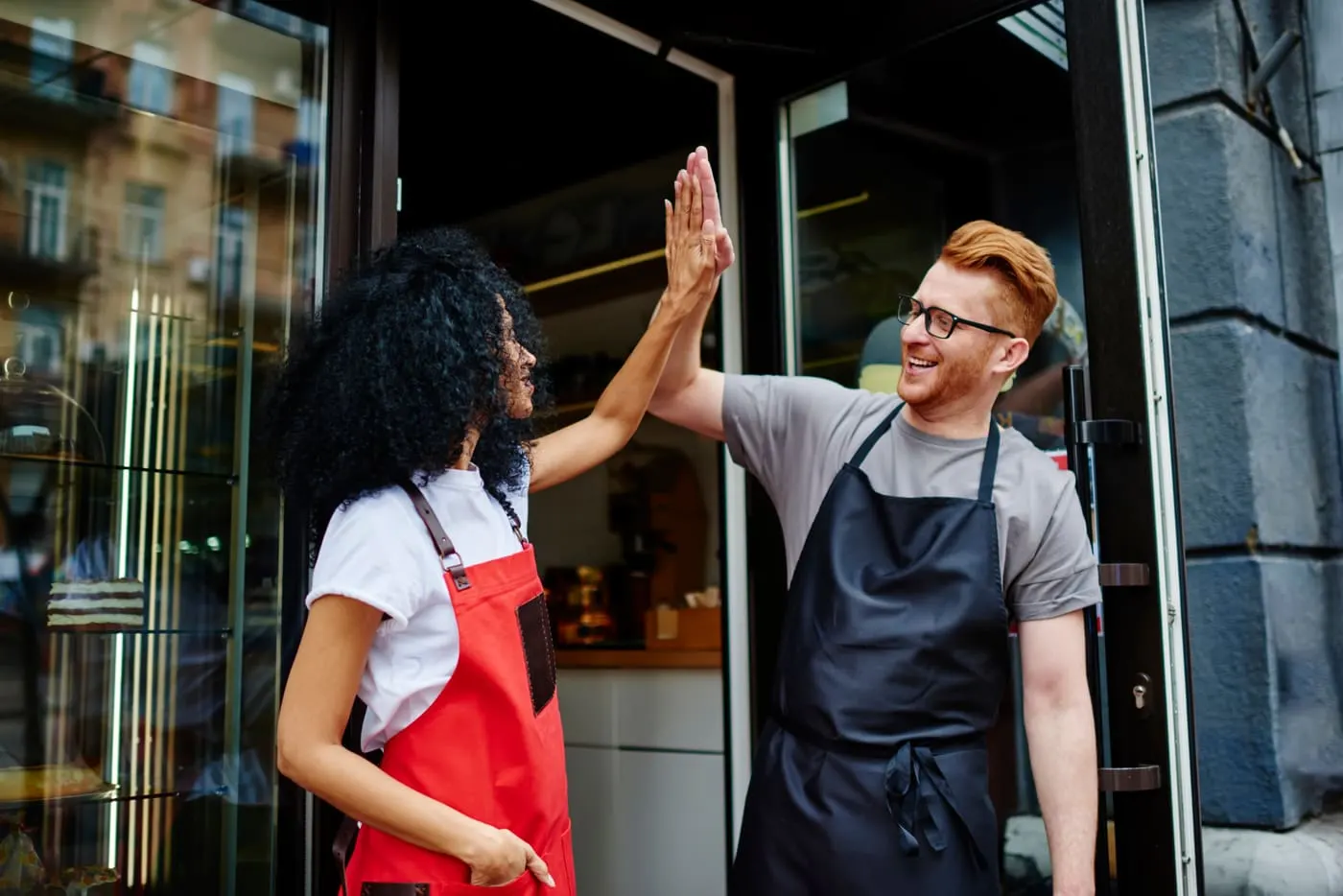 Small business owners celebrating a win